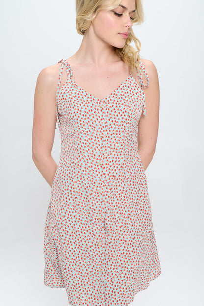 ALL OVER HEART PRINT SPAGHETTI STRAP DRESS WITH POCKETS